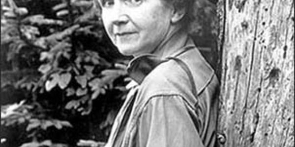 Rachel Carson leaning against a tree at the U.S. Fish and Wildlife Service field office in Michigan.