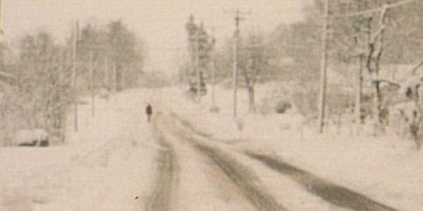 Photo of snow accumulation on a road in western North Carolina in March 1993 courtesy of the National Weather Service