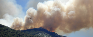 Picture of wildfire, plane over mountain. Courtesy of Pixabay.com.