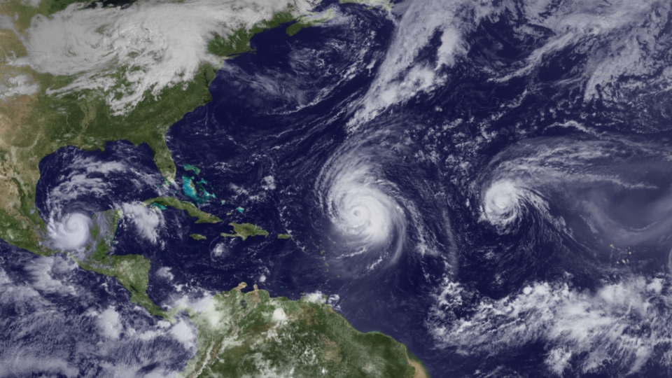 Satellite imagery of Hurricanes Igor, Julia, and Karl in the North Atlantic hurricane basin on 19 September