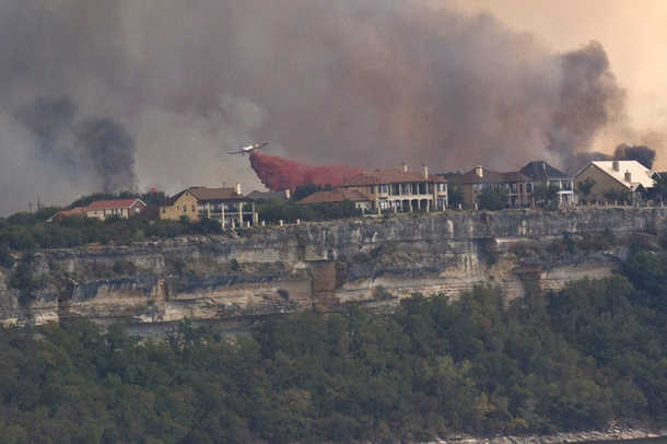 Aerial efforts to protect homes from a major fire on Possum Kingdom Lake in Texas
