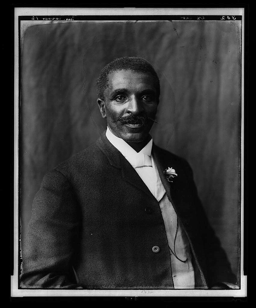 A black and white formal portrait of Dr. George Washington Carver.