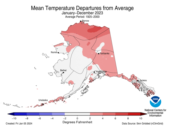 Map of Alaska showing temperature departure from average for 2023 with warmer areas in gradients of red and cooler areas in gradients of blue.