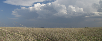 Photo of clouds over Texas Panhandle grassland by Susan Cobb for NOAA