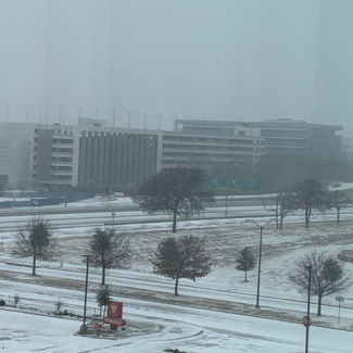 Snow covers roadways near HWY 360 south of DFW Airport