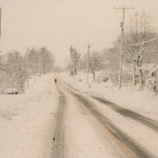 Photo of snow accumulation on a road in western North Carolina in March 1993 courtesy of the National Weather Service