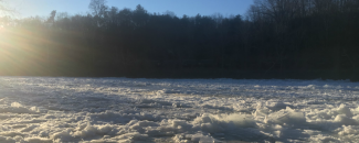 Picture of frozen French Broad River in Asheville, NC, by NOAA/NCEI, Greg Hammer.