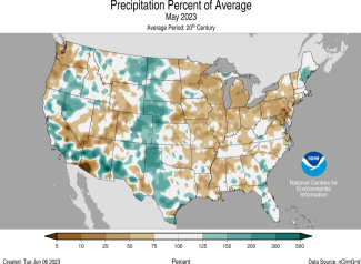 Map of the U.S. showing percent of average precipitation for May 2023 with wetter areas in gradients of green and drier areas in gradients of brown.