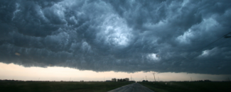 Banner image of dark supercell storm cloud near Enid, Oklahoma, from NOAA
