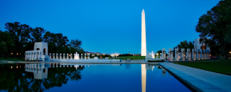 Photo of Washington Monument at night with reflection in pool